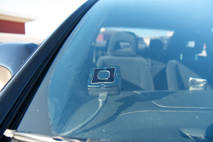 The infrared rain sensor, mounted inside the windshield